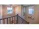 Staircase with a view from the top, with eye-catching light fixture, large window, and neutral walls at 3213 Molinos Dr, Las Vegas, NV 89141