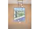 Chandelier hanging over large window with view of outside at 3213 Molinos Dr, Las Vegas, NV 89141