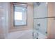 Bright bathroom with a soaking tub, glass shower, and mountain views from window at 322 Karen Ave # 3801, Las Vegas, NV 89109