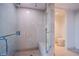 Bathroom includes stand-up shower with bench seating and glass door at 322 Karen Ave # 3801, Las Vegas, NV 89109