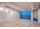 Bright bedroom with tiled floor, recessed lighting, and large windows showcasing city views at 322 Karen Ave # 3801, Las Vegas, NV 89109
