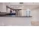 Modern kitchen with breakfast bar, stainless steel appliances, and tile flooring at 322 Karen Ave # 3801, Las Vegas, NV 89109