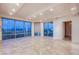 Bright and airy living room boasting panoramic windows, elegant flooring, and recessed lighting at 322 Karen Ave # 3801, Las Vegas, NV 89109