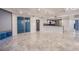 Open-concept living room with seamless flow into the kitchen, enhanced by marble floors and ample natural light at 322 Karen Ave # 3801, Las Vegas, NV 89109