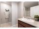 Single sink bathroom with a modern vanity, large mirror, and neutral color scheme, creating a relaxing atmosphere at 3221 Pergusa Dr, Henderson, NV 89044
