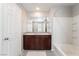 This bathroom features a double sink vanity, a shower-tub combination, and tile flooring at 3221 Pergusa Dr, Henderson, NV 89044