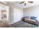 This bedroom is staged with a closet and sitting area at 3221 Pergusa Dr, Henderson, NV 89044
