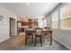 Cozy dining area with a wooden table, adjacent to the kitchen, perfect for Gathering meals at 3221 Pergusa Dr, Henderson, NV 89044