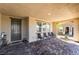Inviting front porch featuring a brick-paved floor and comfortable seating area for relaxing outdoors at 3221 Pergusa Dr, Henderson, NV 89044