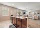 Open-concept kitchen and living area with granite countertops and stainless steel appliances at 3221 Pergusa Dr, Henderson, NV 89044