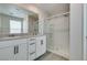 Bathroom featuring a vanity and glass shower with gray wood-look floors at 3270 Palindrome Ave, Henderson, NV 89044