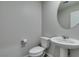 Powder bathroom features a pedestal sink and a modern toilet at 3270 Palindrome Ave, Henderson, NV 89044