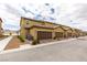 Charming townhome exterior featuring a private garage, desert landscaping, and a tile roof at 3270 Palindrome Ave, Henderson, NV 89044