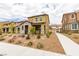 View of charming two-story home with landscaped yard, sidewalk and driveways with surrounding homes at 3270 Palindrome Ave, Henderson, NV 89044