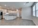 Open-concept kitchen with stainless steel appliances and large island at 3270 Palindrome Ave, Henderson, NV 89044