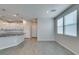 Open-concept kitchen features modern lighting, stone countertops, and white cabinets at 3270 Palindrome Ave, Henderson, NV 89044