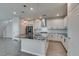 Stylish kitchen features an island with black countertops and pendant lighting at 3270 Palindrome Ave, Henderson, NV 89044