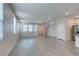 Open-concept living area adjacent to kitchen with staircase at 3270 Palindrome Ave, Henderson, NV 89044