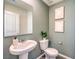 Cozy powder room with a classic pedestal sink and neutral-toned walls at 3389 La Cura Ave # Lot 43, Las Vegas, NV 89141