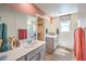 Well-lit bathroom features dual sinks, a large mirror, and access to a walk-in closet at 3389 La Cura Ave # Lot 43, Las Vegas, NV 89141