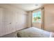 Bright bedroom features a comfortable bed and a window for natural light at 3389 La Cura Ave # Lot 43, Las Vegas, NV 89141