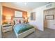 Well decorated bedroom featuring a bed with decorative pillows, lamps on the nightstands, and neutral-colored walls at 3389 La Cura Ave # Lot 43, Las Vegas, NV 89141