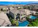 Aerial view of a neighborhood featuring homes with private pools and landscaped backyards at 361 Cooper Hawk Ct, Las Vegas, NV 89138