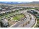 Aerial view of a community park with green space and landscaped areas at 361 Cooper Hawk Ct, Las Vegas, NV 89138