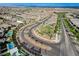 Aerial view of a neighborhood streetscape with mature landscaping and community park at 361 Cooper Hawk Ct, Las Vegas, NV 89138