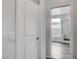 Hallway door leading to a bathroom with a soaking tub and shower behind a glass partition at 361 Cooper Hawk Ct, Las Vegas, NV 89138