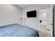 Relaxing bedroom with a mounted television, closet, and a calming atmosphere at 361 Cooper Hawk Ct, Las Vegas, NV 89138