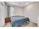 Cozy bedroom features plush carpet, a comfortable bed, and a window providing natural light at 361 Cooper Hawk Ct, Las Vegas, NV 89138