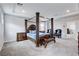Bright bedroom with a four-poster bed, side tables, and seating area, creating a relaxing retreat at 361 Cooper Hawk Ct, Las Vegas, NV 89138