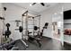Home gym with weight rack and fitness bike, providing convenient workout space at 361 Cooper Hawk Ct, Las Vegas, NV 89138