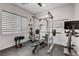 Home gym featuring weight rack, bench, and exercise equipment for a complete workout at 361 Cooper Hawk Ct, Las Vegas, NV 89138