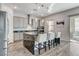 Modern kitchen with an island, stainless steel appliances, and access to an outdoor patio at 361 Cooper Hawk Ct, Las Vegas, NV 89138