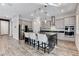 Modern kitchen features stainless steel appliances and a large granite island with counter seating at 361 Cooper Hawk Ct, Las Vegas, NV 89138