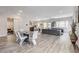 Spacious living space with open layout, modern furniture, and seamless transition to dining and kitchen areas at 361 Cooper Hawk Ct, Las Vegas, NV 89138