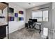 Bright office space with storage shelves, a large window, and mountain views in the distance at 361 Cooper Hawk Ct, Las Vegas, NV 89138