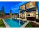 Sparkling backyard pool with outdoor bar, lounge area and manicured backyard, great for outdoor entertaining at 361 Cooper Hawk Ct, Las Vegas, NV 89138