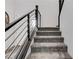 Carpeted stairway with modern railings leading to the upper level of the home at 361 Cooper Hawk Ct, Las Vegas, NV 89138