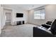Comfortable media room with plush seating, perfect for movie nights at home at 361 Cooper Hawk Ct, Las Vegas, NV 89138