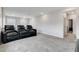 Spacious media room with comfortable seating, creating an ideal home entertainment space at 361 Cooper Hawk Ct, Las Vegas, NV 89138