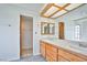 Bathroom featuring double sinks, tile counters, and a walk-in shower at 4083 Nook Way # D, Las Vegas, NV 89103