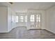 Bedroom with wood-look floors and arched windows at 4083 Nook Way # D, Las Vegas, NV 89103