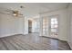 Spacious bedroom featuring wood-look floors, a ceiling fan, and an ample closet at 4083 Nook Way # D, Las Vegas, NV 89103