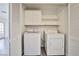 Laundry room with washer, dryer, storage cabinets, and shelving at 4083 Nook Way # D, Las Vegas, NV 89103