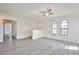 Bright living room with wood-look floors and arched windows offering natural light at 4083 Nook Way # D, Las Vegas, NV 89103