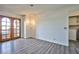 Living area with view of laundry and exterior patio through wood-look patio doors at 4083 Nook Way # D, Las Vegas, NV 89103