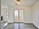 Sunlit living area with stone fireplace and wood patio doors leading outside at 4083 Nook Way # D, Las Vegas, NV 89103
